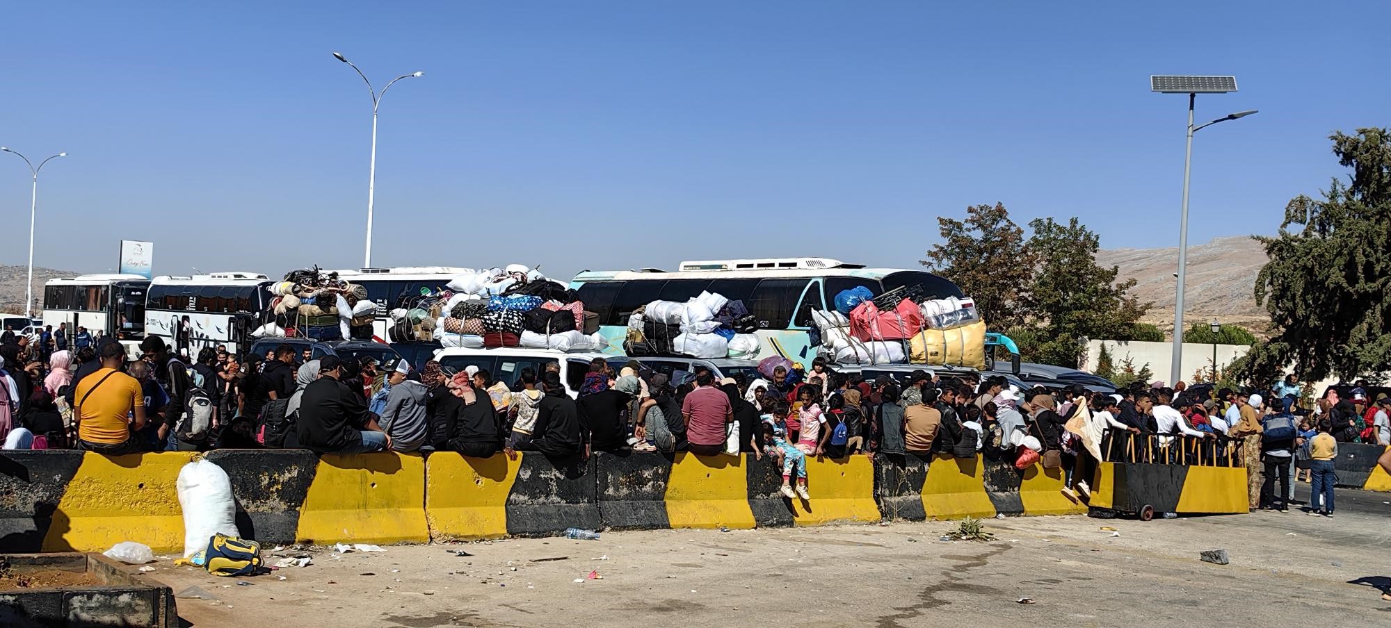 Syrian and Lebanese families who fled the violence have crossed into Syria.