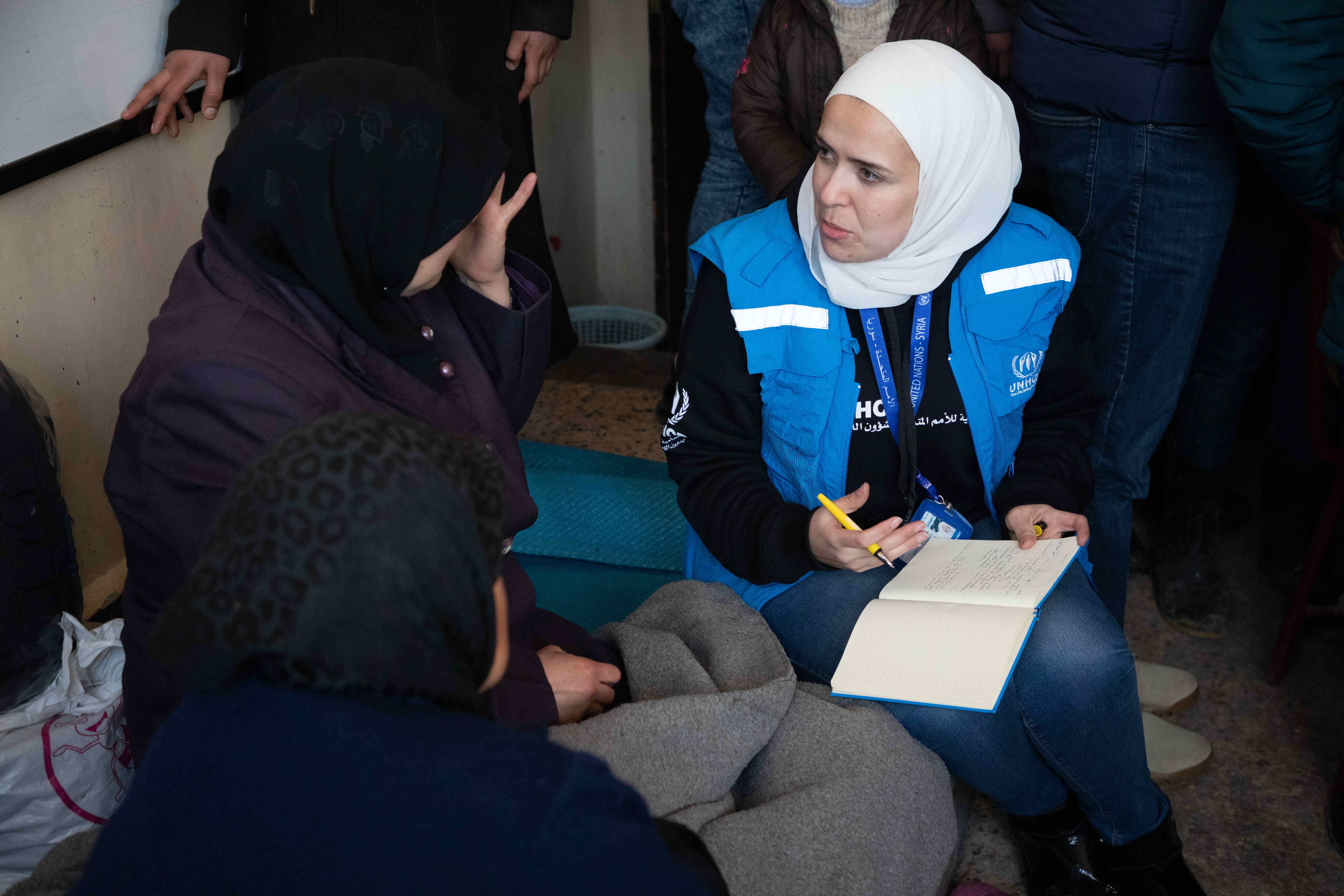 A woman receiving support from a UNHCR worked