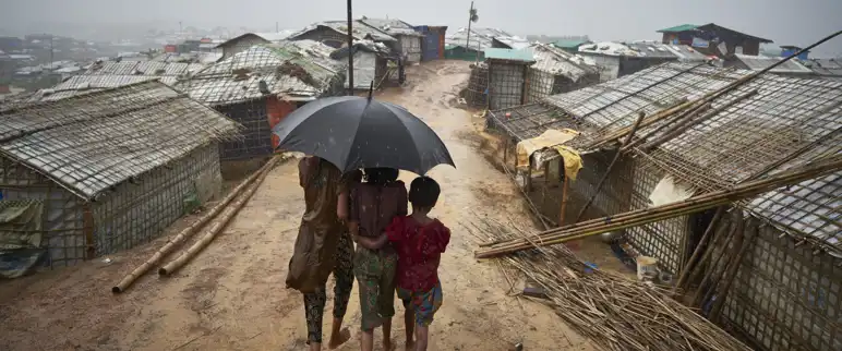 Bangladesh. Rohingya Refugees Walk Through A Heavy Downpour Min