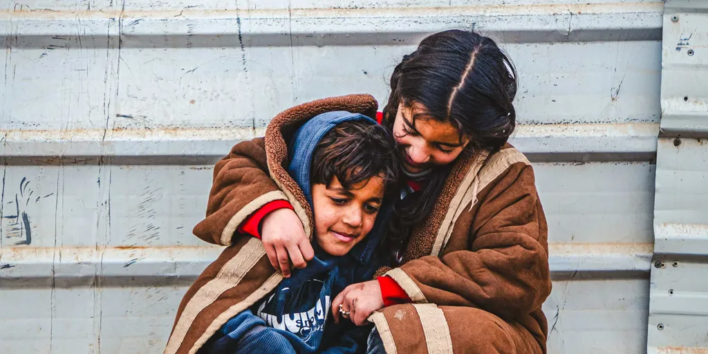 Jordan_children-smiling-through-the-harsh-winter