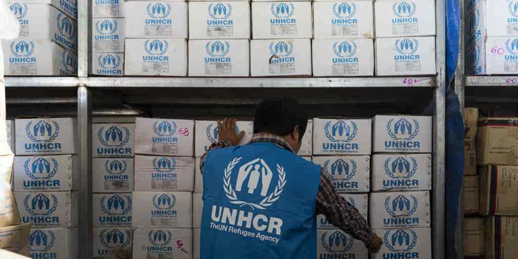 A UNHCR worker prepares the aid for survivors of the Myanmar earthquake.