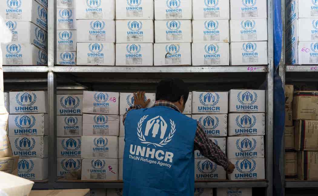 A UNHCR worker prepares the aid for survivors of the Myanmar earthquake.