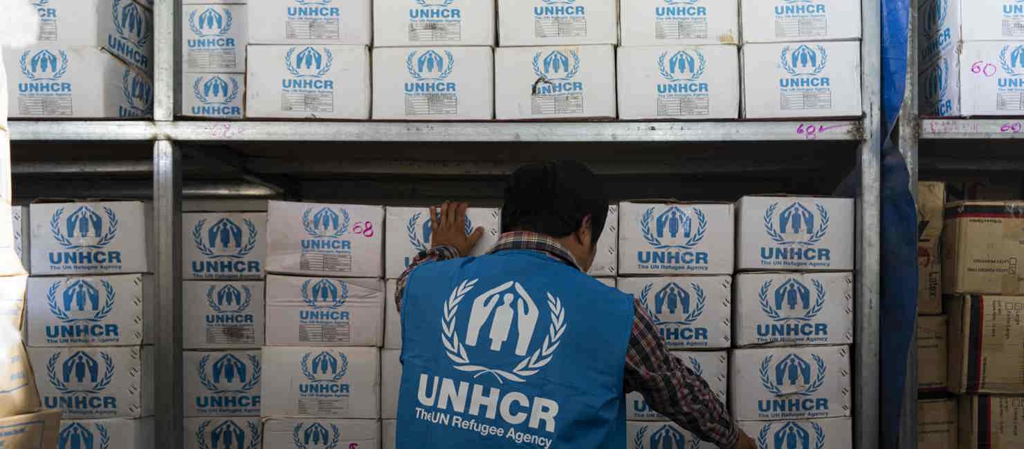 A UNHCR worker prepares the aid for survivors of the Myanmar earthquake.