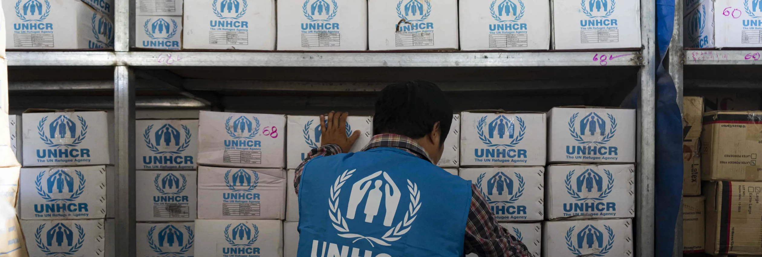 A UNHCR worker prepares the aid for survivors of the Myanmar earthquake.