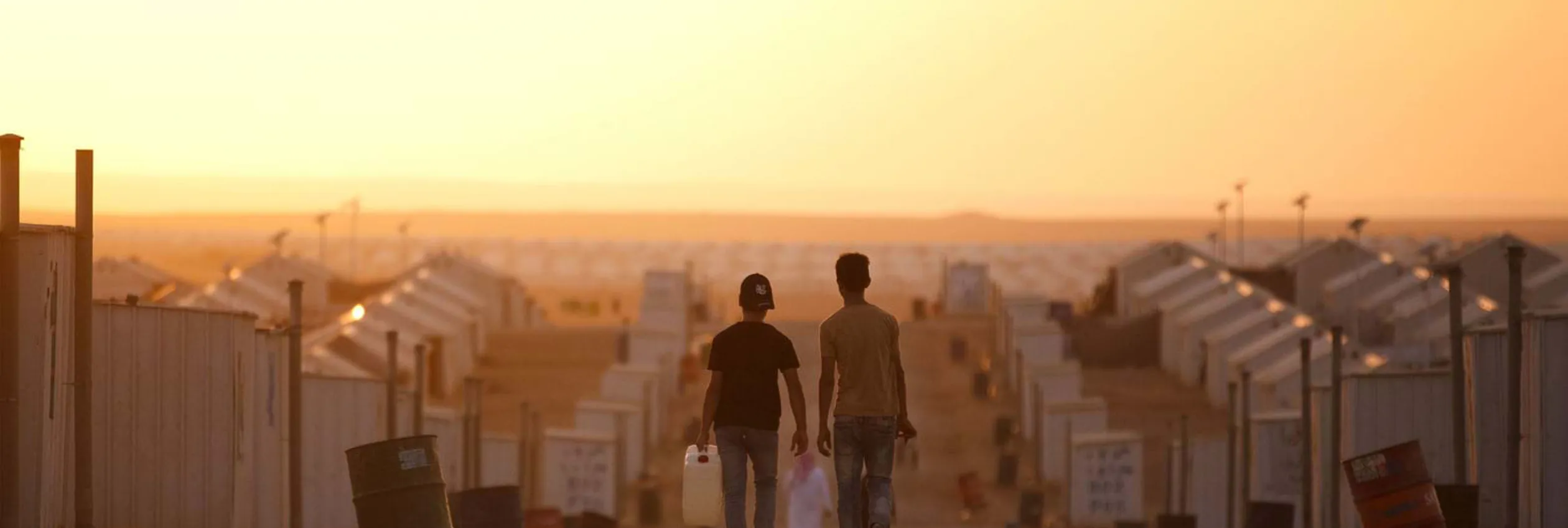 unhcr_footer_hero_two-young-refugee-boys-walking