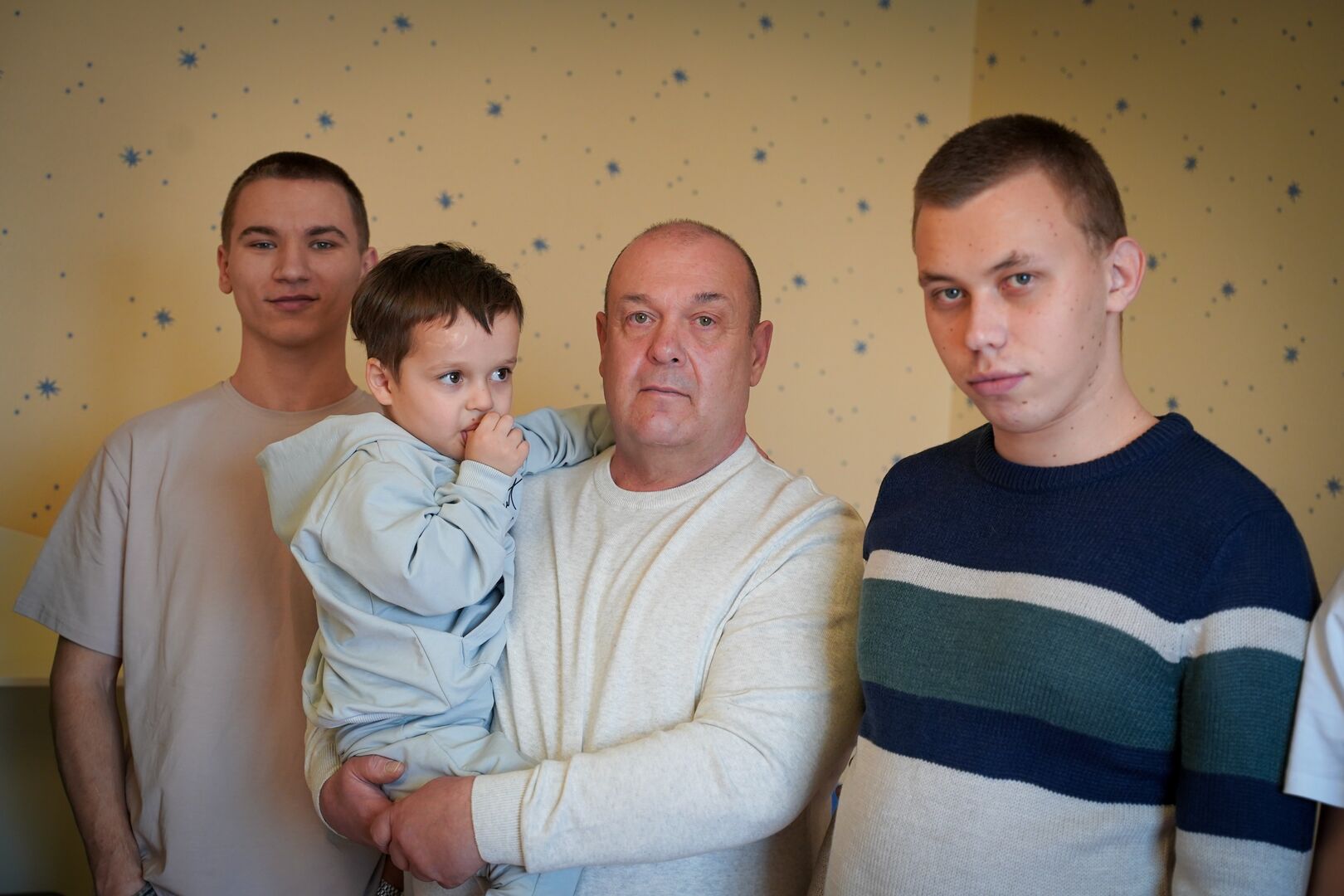 Ruslan and three of his foster children in their new home in Odesa. They were forced to flee Kherson when their home was destroyed.