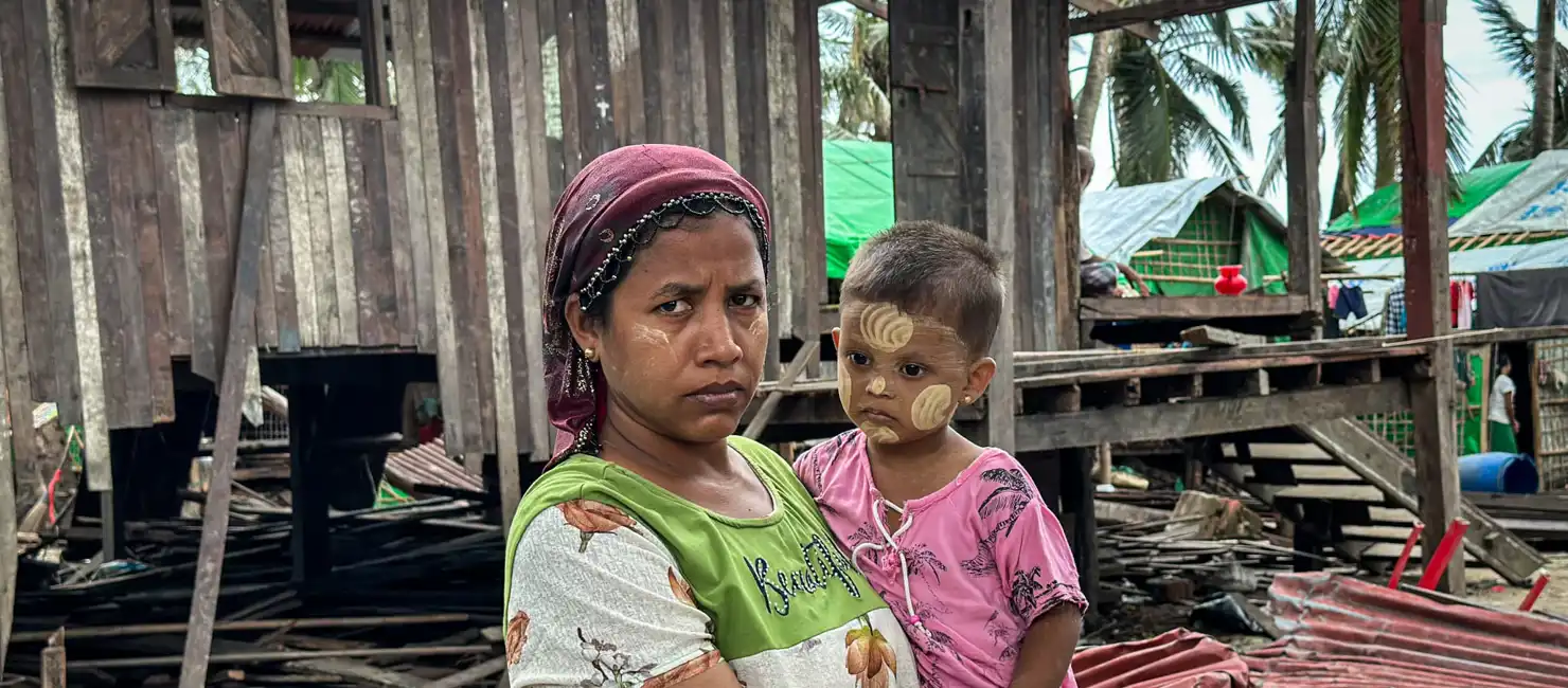 banner_myanmar_woman-and-child-damaged-home-after-cyclone-mocha