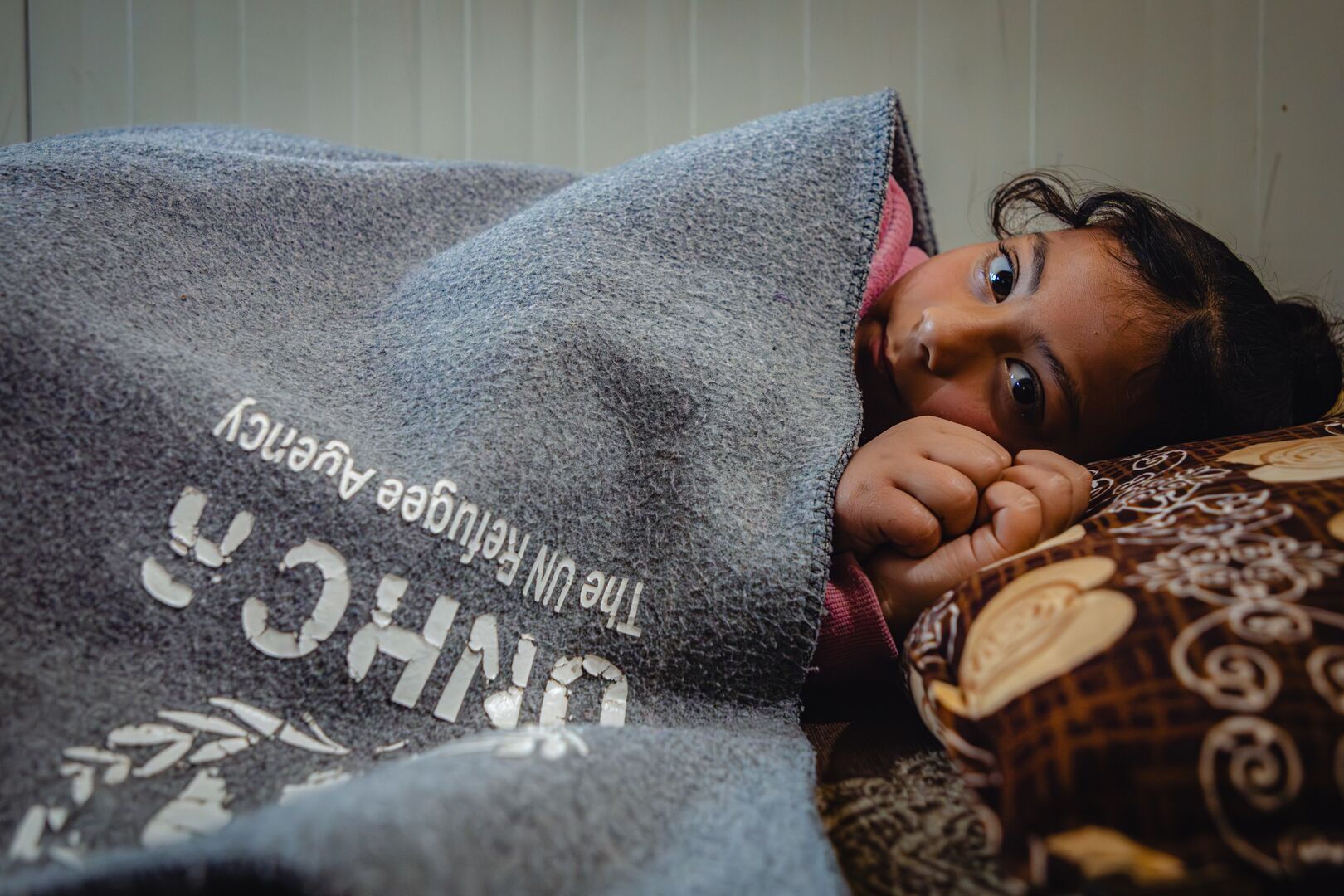 Website-Jordan. Khadija covers her granddaughter Yasmeen (8 years old) inside their shelter in Zaatari camp.jpg